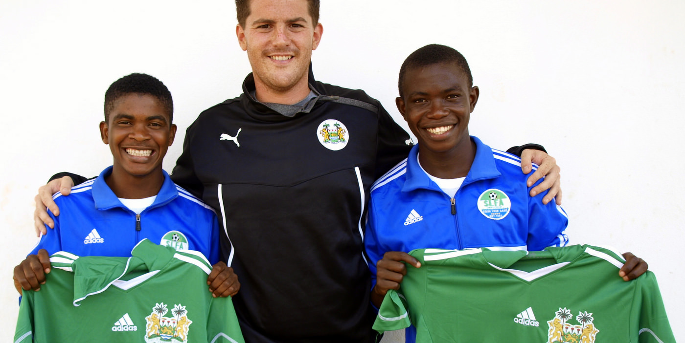 Coach McKinstry with CBF Academy players Santigie Koroma and Sulaiman Samura who were selected for Sierra Leone U-20 [versus Guinea in 2015 CAF U-20 first round qualifying (Picture: Myrthe van Vliet)]